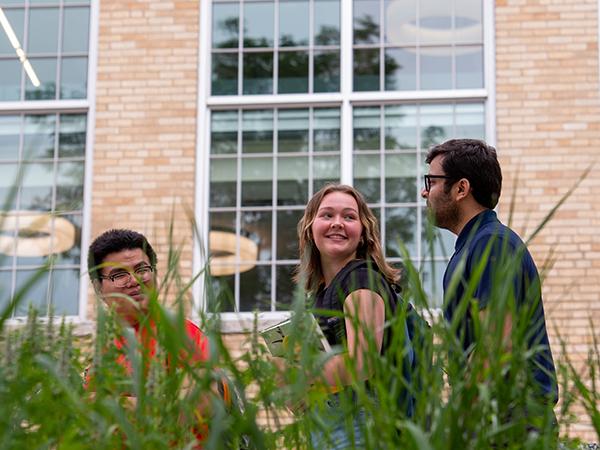 Students walking by Eastman Hall